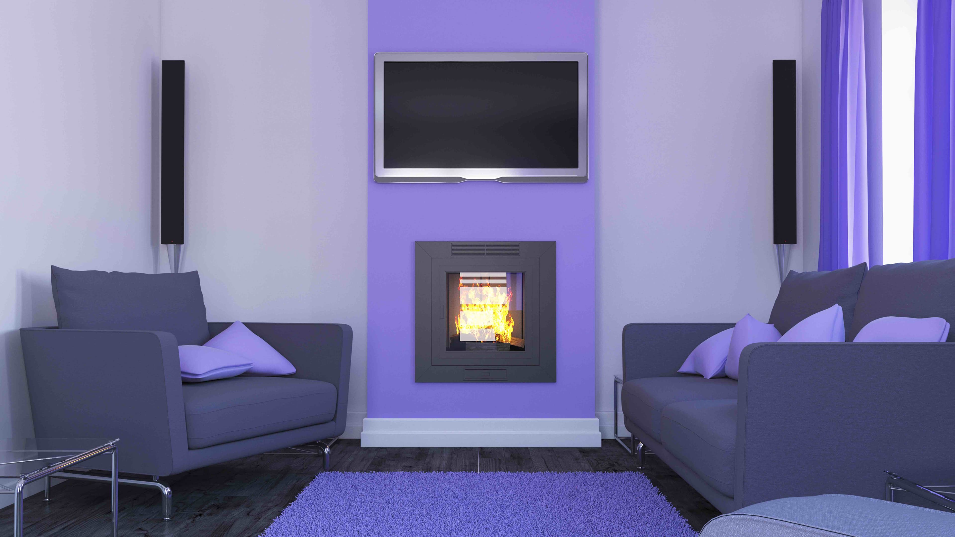 Modern purple living room with a fireplace, wall-mounted TV, grey sofas, and purple rug.
